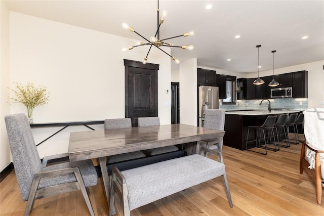 750 Independence Rd Unit 2C, Keystone, CO 80435 - dining room with a chandelier, light wood-type flooring, and recessed lighting