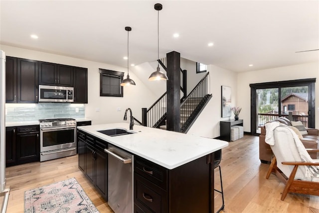 750 Independence Rd Unit 2C, Keystone, CO 80435 - kitchen with stainless steel appliances, a sink, open floor plan, light countertops, and recessed lighting