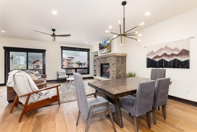 750 Independence Rd Unit 2C, Keystone, CO 80435 - dining room featuring a fireplace, light wood-style floors, a chandelier, baseboards, and recessed lighting