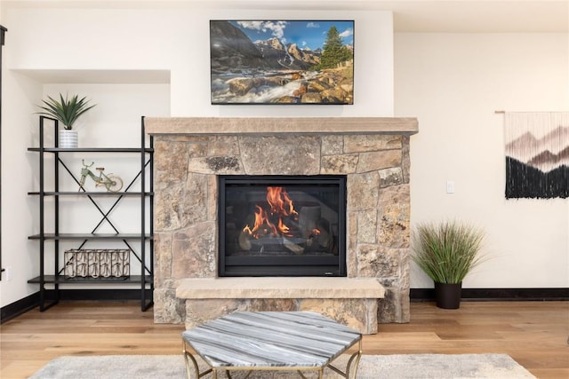 750 Independence Rd Unit 2C, Keystone, CO 80435 - detailed view of wood finished floors, a glass covered fireplace, and baseboards