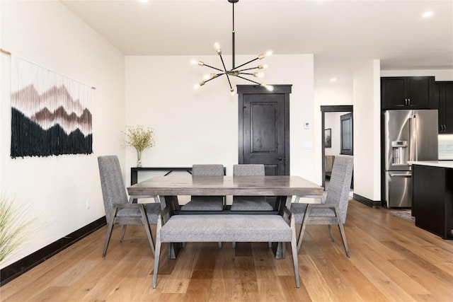750 Independence Rd Unit 2C, Keystone, CO 80435 - dining room featuring a chandelier, light wood-style flooring, baseboards, and recessed lighting