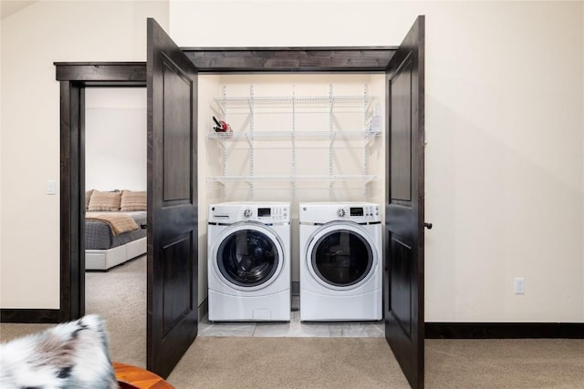 750 Independence Rd Unit 2C, Keystone, CO 80435 - laundry room with washing machine and clothes dryer, carpet floors, and baseboards