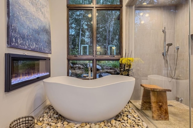 313 Raven Golf Ln, Silverthorne, CO 80498 - bathroom featuring a freestanding bath and walk in shower
