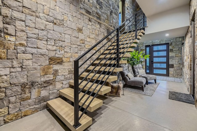 313 Raven Golf Ln, Silverthorne, CO 80498 - stairway featuring finished concrete flooring and a towering ceiling