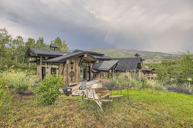 313 Raven Golf Ln, Silverthorne, CO 80498 - rear view of property with a standing seam roof and a metal roof