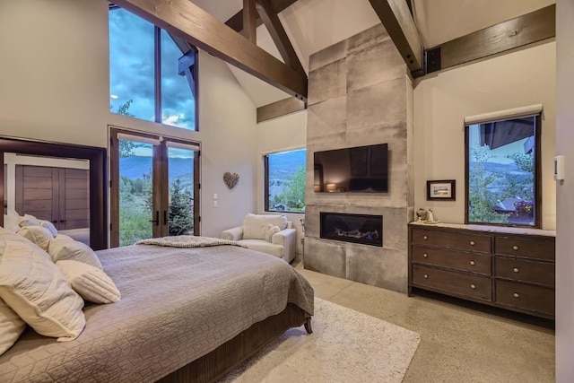 313 Raven Golf Ln, Silverthorne, CO 80498 - bedroom with high vaulted ceiling, beamed ceiling, access to exterior, a fireplace, and dark aggregate flooring