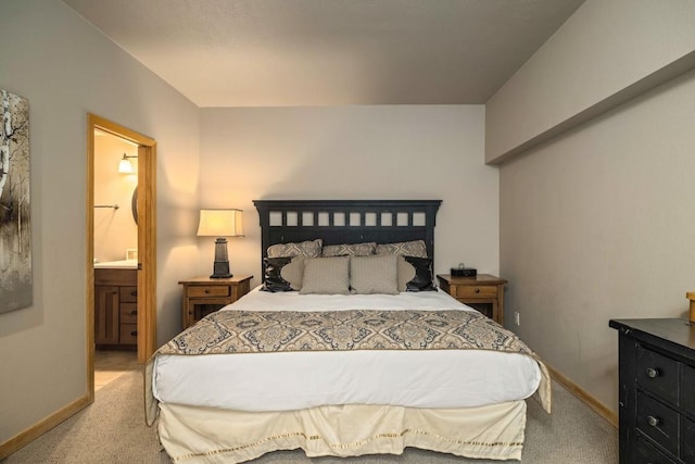 2800 Village Dr Unit 1302, Steamboat Springs, CO 80487 - bedroom featuring light carpet, baseboards, and ensuite bathroom