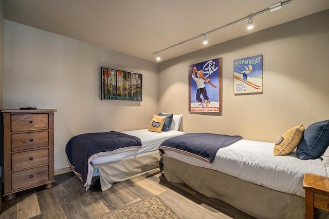 2800 Village Dr Unit 1302, Steamboat Springs, CO 80487 - bedroom with rail lighting and wood finished floors