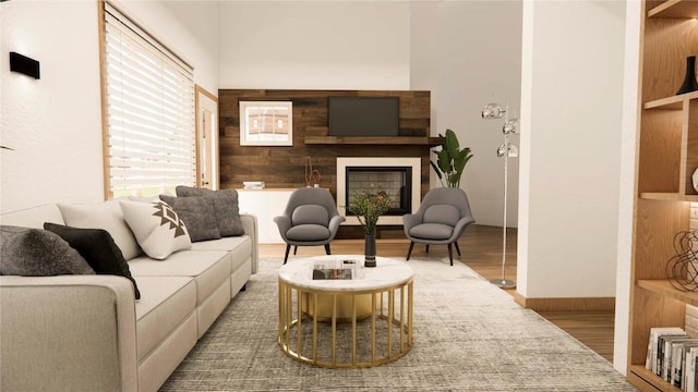 2800 Village Dr Unit 1302, Steamboat Springs, CO 80487 - living area featuring wood finished floors, a fireplace, and baseboards