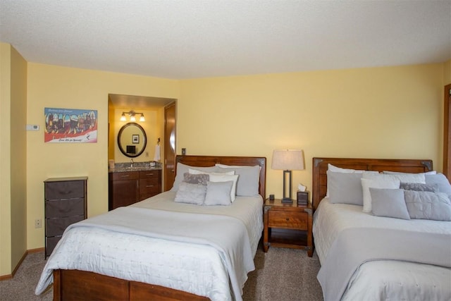 carpeted bedroom featuring baseboards