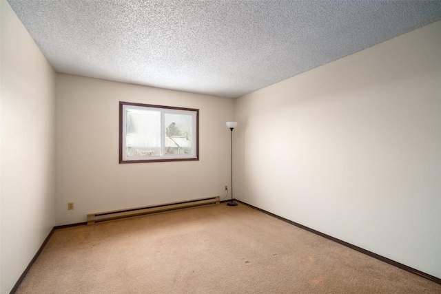 13 Sequoia Ct Unit 13, Steamboat Springs, CO 80487 - unfurnished room featuring a baseboard heating unit, baseboards, a textured ceiling, and light colored carpet