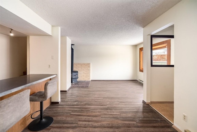 13 Sequoia Ct Unit 13, Steamboat Springs, CO 80487 - interior space featuring dark wood finished floors, a textured ceiling, and baseboards