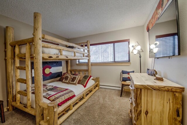 carpeted bedroom with a textured ceiling and baseboard heating