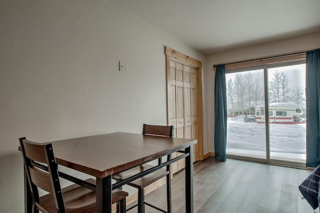 1133 Straight Creek Dr Unit 108, Dillon, CO 80435 - dining room featuring light wood-style flooring and baseboards