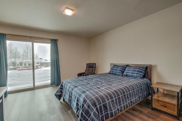 1133 Straight Creek Dr Unit 108, Dillon, CO 80435 - bedroom with access to exterior and wood finished floors