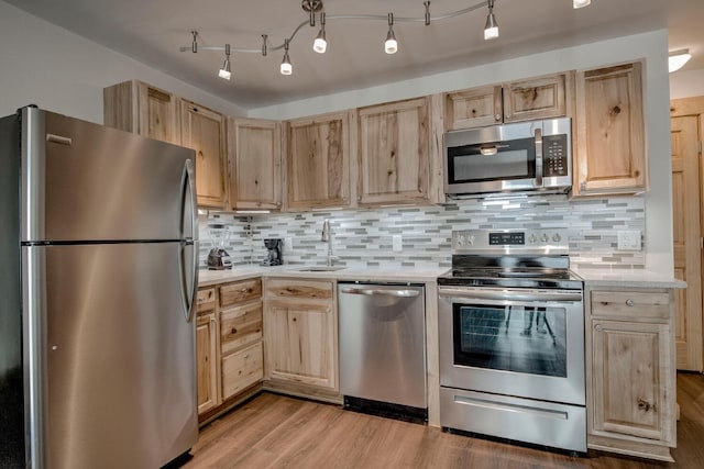1133 Straight Creek Dr Unit 108, Dillon, CO 80435 - kitchen featuring stainless steel appliances, light brown cabinetry, light countertops, and light wood-type flooring