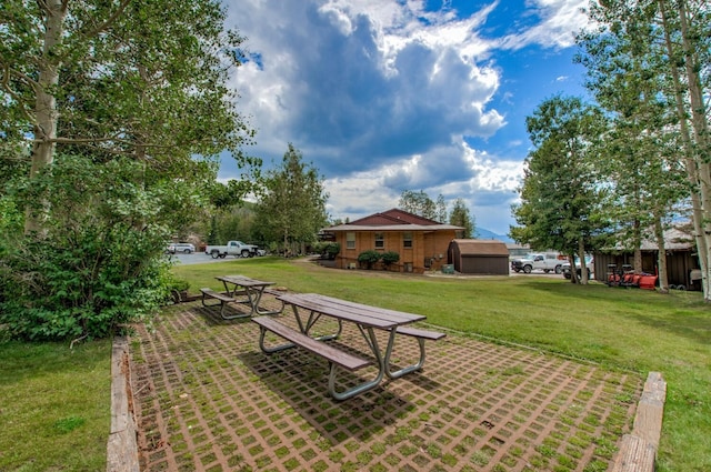 1133 Straight Creek Dr Unit 108, Dillon, CO 80435 - view of grassy yard with a storage unit
