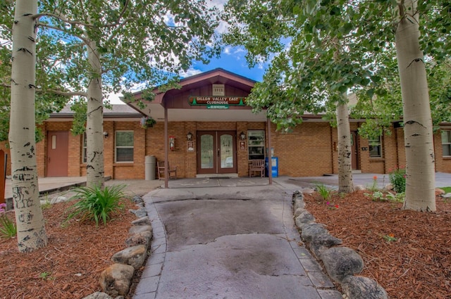 1133 Straight Creek Dr Unit 108, Dillon, CO 80435 - view of front of home featuring french doors and brick siding