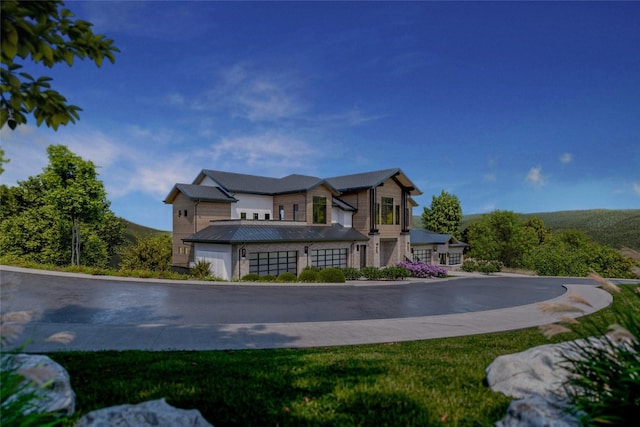 2410 Ski Trail Ln Unit 701, Steamboat Springs, CO 80487 - view of front of property featuring a garage and metal roof