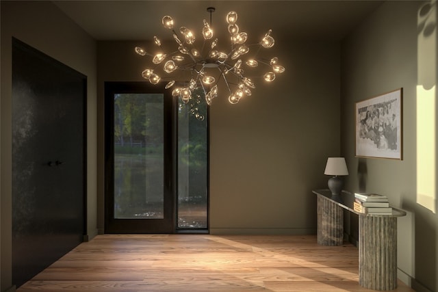 2410 Ski Trail Ln Unit 701, Steamboat Springs, CO 80487 - doorway featuring wood finished floors and an inviting chandelier