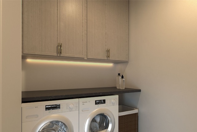 2410 Ski Trail Ln Unit 701, Steamboat Springs, CO 80487 - laundry area featuring cabinet space and washer and dryer