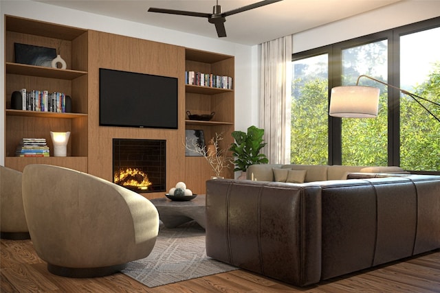2410 Ski Trail Ln Unit 701, Steamboat Springs, CO 80487 - living area featuring a fireplace, wood finished floors, built in features, and a ceiling fan