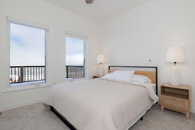 bedroom featuring baseboards and carpet floors