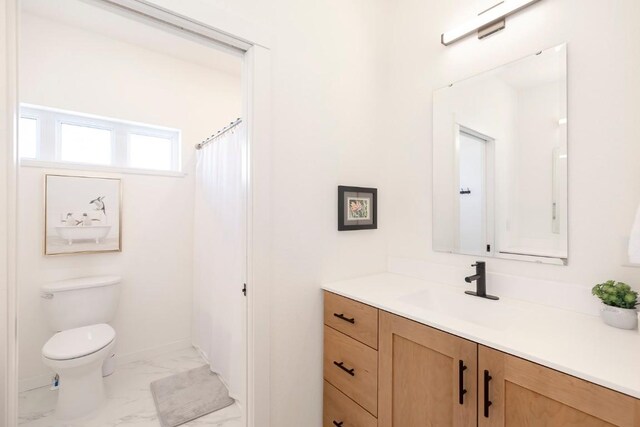 1110 Mt Neva Dr, Granby, CO 80446 - bathroom featuring baseboards, marble finish floor, vanity, and toilet