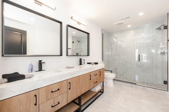 bathroom with a shower stall, a sink, marble finish floor, double vanity, and toilet