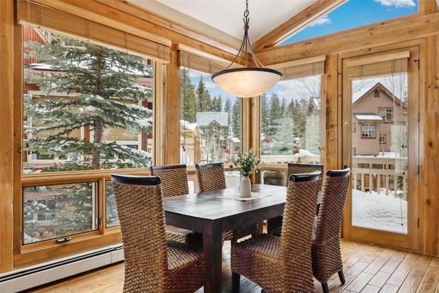 129 Tip Top Trl Unit 6543, Keystone, CO 80435 - dining room featuring a baseboard heating unit, light wood-style floors, and lofted ceiling