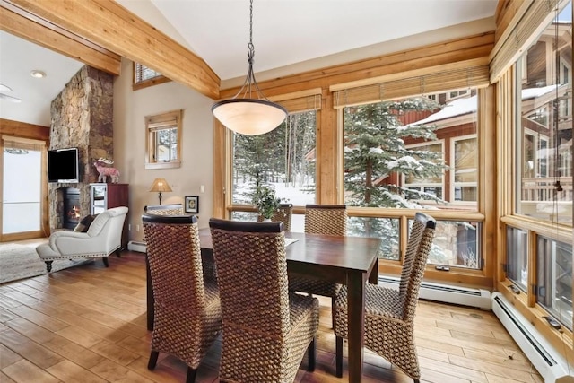 129 Tip Top Trl Unit 6543, Keystone, CO 80435 - dining room featuring a baseboard radiator, wood finished floors, and vaulted ceiling with beams