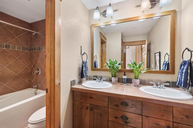 129 Tip Top Trl Unit 6543, Keystone, CO 80435 - full bath featuring shower / bathing tub combination, a textured wall, and a sink