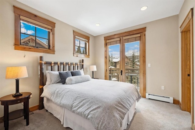 129 Tip Top Trl Unit 6543, Keystone, CO 80435 - bedroom featuring a baseboard heating unit, baseboards, light colored carpet, and access to outside