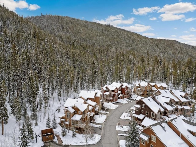 129 Tip Top Trl Unit 6543, Keystone, CO 80435 - snowy aerial view featuring a residential view, a wooded view, and a mountain view