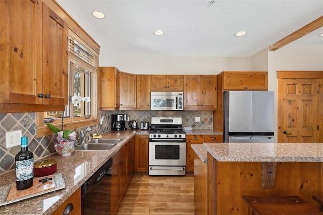 129 Tip Top Trl Unit 6543, Keystone, CO 80435 - kitchen with brown cabinets, light wood-type flooring, stainless steel appliances, and a sink