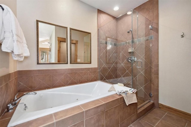 129 Tip Top Trl Unit 6543, Keystone, CO 80435 - bathroom with tile patterned floors, a shower stall, and a tub with jets
