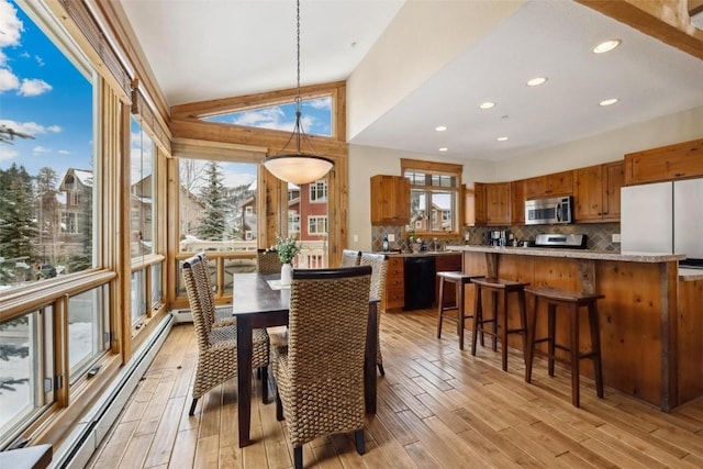 129 Tip Top Trl Unit 6543, Keystone, CO 80435 - dining space with baseboard heating, a wealth of natural light, recessed lighting, and light wood-type flooring