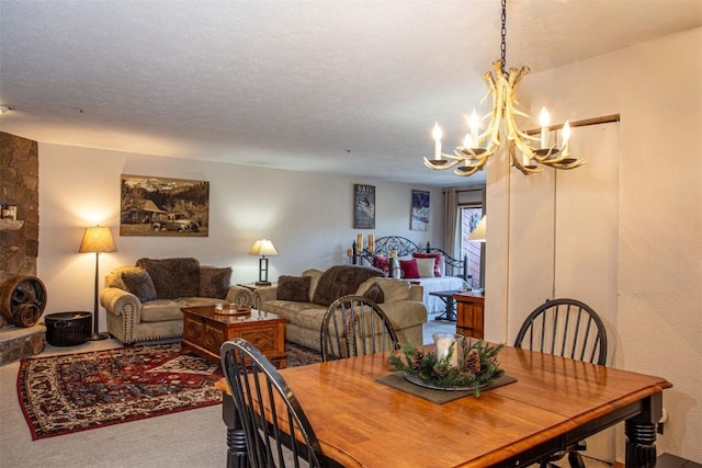 carpeted dining room with an inviting chandelier
