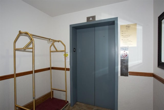 hallway featuring elevator
