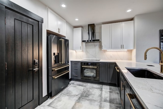 1891 Ski Hill Rd Unit 7404, Breckenridge, CO 80424 - kitchen featuring wall chimney range hood, light stone counters, a sink, white cabinetry, and black appliances