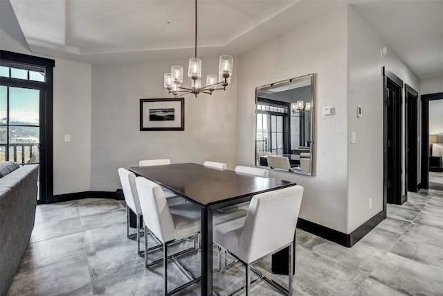 1891 Ski Hill Rd Unit 7404, Breckenridge, CO 80424 - dining space with baseboards, an inviting chandelier, and a tray ceiling