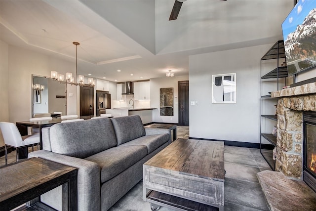 1891 Ski Hill Rd Unit 7404, Breckenridge, CO 80424 - living area with baseboards, a fireplace, ceiling fan with notable chandelier, and recessed lighting