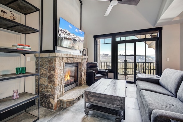 1891 Ski Hill Rd Unit 7404, Breckenridge, CO 80424 - living area with high vaulted ceiling, a ceiling fan, concrete floors, and a stone fireplace