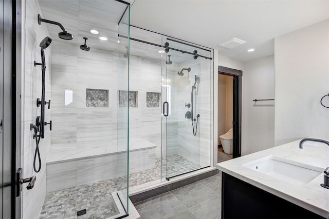 1891 Ski Hill Rd Unit 7404, Breckenridge, CO 80424 - bathroom featuring tile patterned flooring, a shower stall, vanity, toilet, and recessed lighting