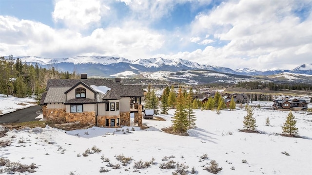 174 Sage Dr, Breckenridge, CO 80424 - back of house featuring a mountain view and stone siding