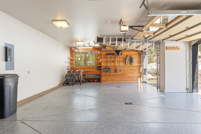 174 Sage Dr, Breckenridge, CO 80424 - garage with baseboards, a workshop area, and a garage door opener