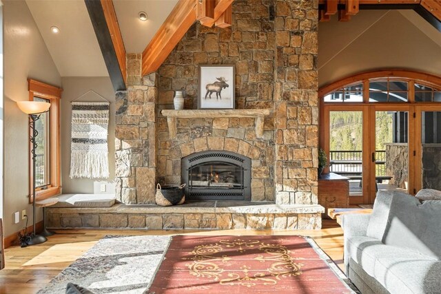 174 Sage Dr, Breckenridge, CO 80424 - living room with lofted ceiling with beams, a fireplace, recessed lighting, baseboards, and wood finished floors
