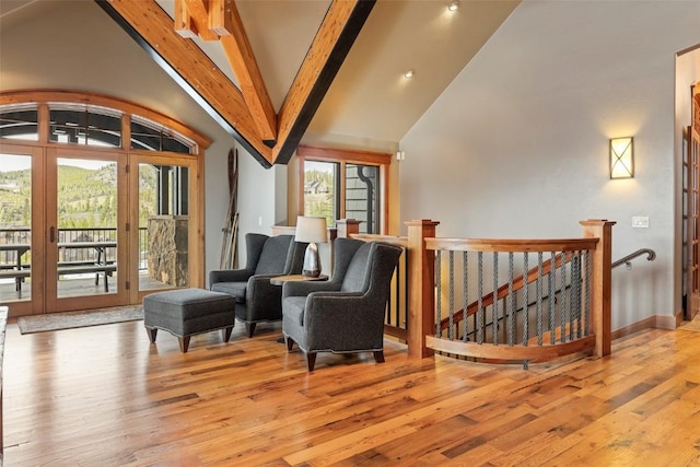 174 Sage Dr, Breckenridge, CO 80424 - sitting room with wood-type flooring, beamed ceiling, an upstairs landing, and french doors