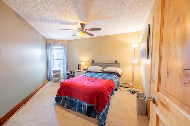 bedroom featuring a baseboard radiator, carpet floors, a textured ceiling, and baseboards