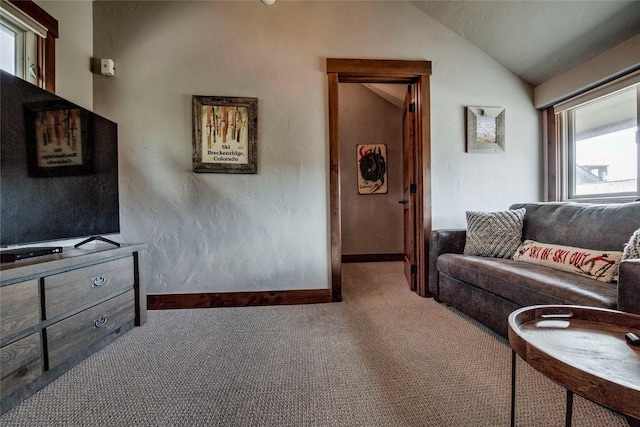 107 Ski Watch Rd Unit 432, Breckenridge, CO 80424 - carpeted living area with vaulted ceiling and baseboards